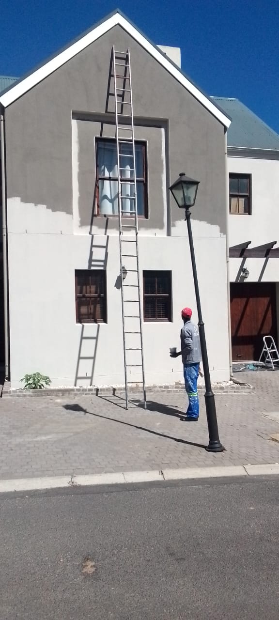 Exterior painting on scaffolding