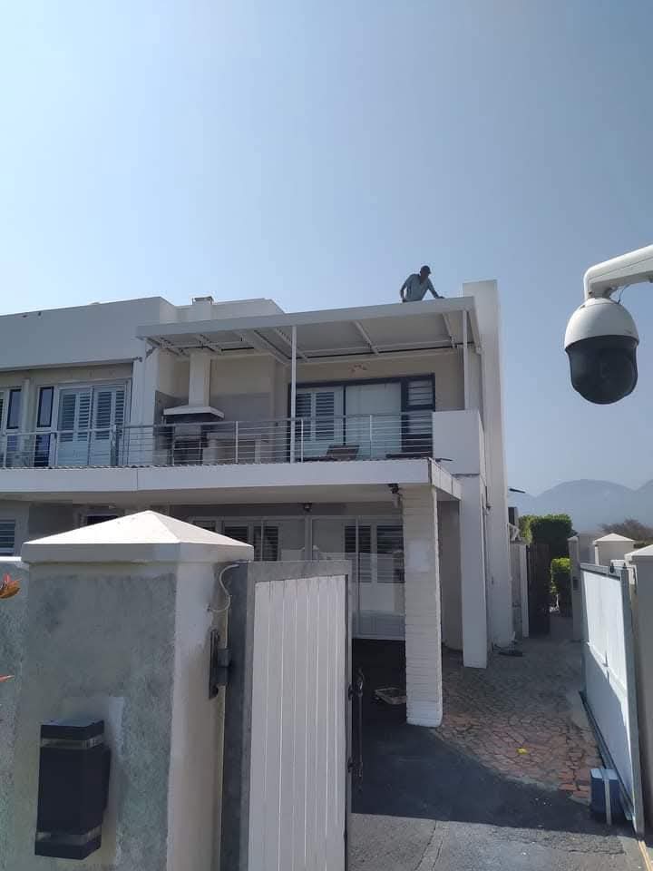 Exterior house painting — roof work