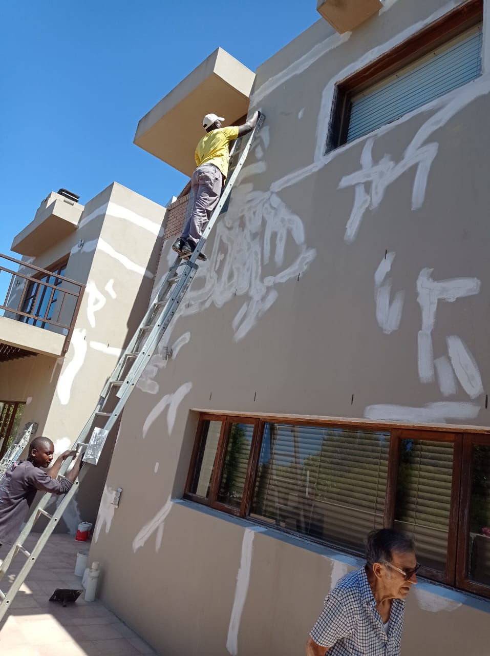 Exterior wall preparation and painting