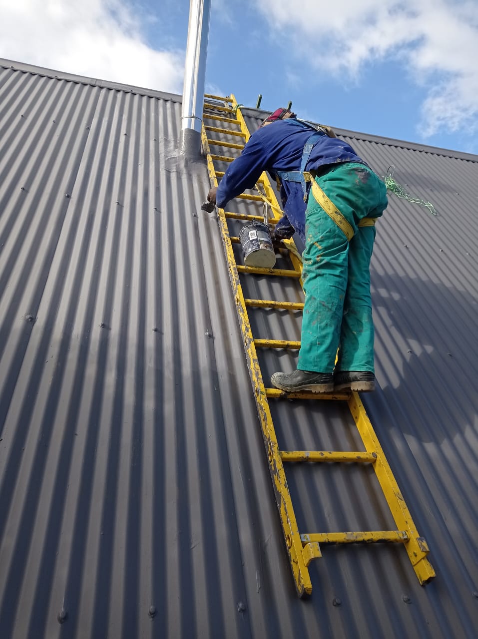 Roof painting on corrugated iron roof