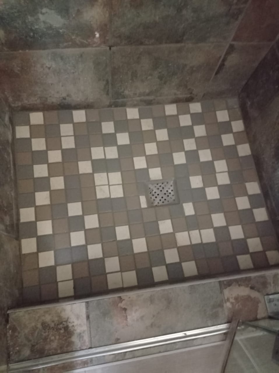 Mosaic shower floor tiling