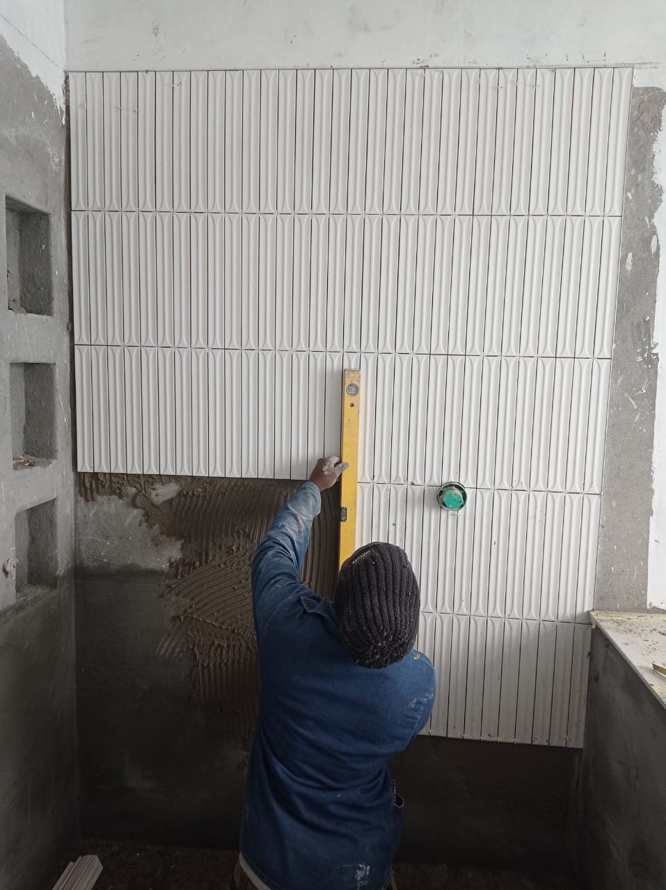 Wall tiling in progress